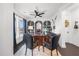 Elegant office with custom bookshelves, a large desk, and neutral carpet at 218 Floral Valley Dr, Woodstock, GA 30188