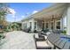 Outdoor patio with fire pit table, ample seating, and professionally landscaped yard ideal for relaxing and entertaining guests at 218 Floral Valley Dr, Woodstock, GA 30188