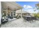 Expansive outdoor patio boasts a fire pit table and ample seating, perfect for enjoying outdoor gatherings and leisure at 218 Floral Valley Dr, Woodstock, GA 30188