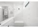 Modern shower with white subway tile, glass surround, and a built-in bench seat at 218 Floral Valley Dr, Woodstock, GA 30188