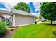 Back of house showing covered patio, landscaping and green grass at 2763 Nautical Way, Villa Rica, GA 30180