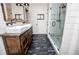Charming bathroom featuring a double sink vanity, rustic wood accents, and a modern glass shower enclosure at 2763 Nautical Way, Villa Rica, GA 30180