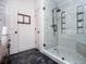 Beautiful bathroom showcasing a glass shower with tiled details and recessed shelves at 2763 Nautical Way, Villa Rica, GA 30180