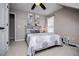 Comfortable bedroom with neutral walls, carpet, ceiling fan and bedside lamp at 2763 Nautical Way, Villa Rica, GA 30180