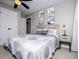 Comfortable bedroom with neutral walls, carpet, ceiling fan and modern art at 2763 Nautical Way, Villa Rica, GA 30180