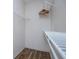 Walk-in closet with shelving units and wood-look flooring at 2763 Nautical Way, Villa Rica, GA 30180