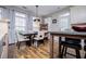 Bright dining area features wood floors, a modern table and chairs, and a large window for natural light at 2763 Nautical Way, Villa Rica, GA 30180