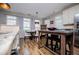 Bright dining area features wood floors, a modern table and chairs, and a large window for natural light at 2763 Nautical Way, Villa Rica, GA 30180