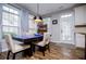Charming dining area features wood floors, a modern table and chairs, and a door leading to the outside at 2763 Nautical Way, Villa Rica, GA 30180