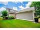 Charming home featuring a well-maintained lawn, attached garage, and inviting curb appeal at 2763 Nautical Way, Villa Rica, GA 30180