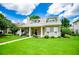 Beautiful home with a covered front porch and lush landscaping, offering a welcoming and serene atmosphere at 2763 Nautical Way, Villa Rica, GA 30180