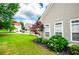 Well-manicured lawn and landscaping compliment the exterior of this charming home with bright windows at 2763 Nautical Way, Villa Rica, GA 30180