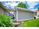 Back of house showing covered patio, landscaping and green grass at 2763 Nautical Way, Villa Rica, GA 30180