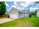 Charming home featuring a well-maintained lawn, attached garage, and inviting curb appeal at 2763 Nautical Way, Villa Rica, GA 30180