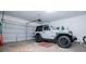 Spacious garage with a Jeep parked inside and plenty of room for storage or projects at 2763 Nautical Way, Villa Rica, GA 30180