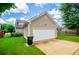 Charming home featuring a well-maintained lawn, attached garage, and inviting curb appeal at 2763 Nautical Way, Villa Rica, GA 30180