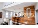 Bright kitchen bar with wood accents, pendant lights, and a granite countertop at 2763 Nautical Way, Villa Rica, GA 30180