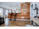 Stylish kitchen bar area with wood paneling, barstools, and pendant lighting at 2763 Nautical Way, Villa Rica, GA 30180