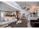 Open living area boasts a kitchen bar, fireplace, and staircase at 2763 Nautical Way, Villa Rica, GA 30180