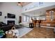 Bright and airy living room with hardwood floors, a cozy fireplace, and stylish decor at 2763 Nautical Way, Villa Rica, GA 30180
