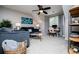 Inviting living room featuring a ceiling fan, window and desk at 2763 Nautical Way, Villa Rica, GA 30180