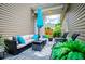 Relaxing covered patio with comfortable seating and outdoor decor at 2763 Nautical Way, Villa Rica, GA 30180