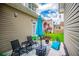 Relaxing patio with comfortable seating, an umbrella, and a view of the landscaped backyard at 2763 Nautical Way, Villa Rica, GA 30180