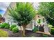 Inviting front porch surrounded by lush landscaping and featuring comfortable seating and ceiling fan at 2763 Nautical Way, Villa Rica, GA 30180