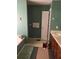 Bathroom with a large soaking tub, a sink, and a toilet behind a closed door at 50 Ranger Se Rd, Cartersville, GA 30121