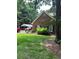 Brick exterior with green shutters, complemented by a well-kept lawn and mature trees at 50 Ranger Se Rd, Cartersville, GA 30121