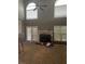 Spacious living room with high ceilings, a fireplace, and large windows that bring in plenty of light at 50 Ranger Se Rd, Cartersville, GA 30121