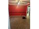 Cozy living room featuring carpet and a red accent wall with neutral trim at 50 Ranger Se Rd, Cartersville, GA 30121