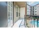 Relaxing balcony overlooking a sparkling pool, offering outdoor living with views of the community at 901 Abernathy Ne Rd # 3020, Atlanta, GA 30328