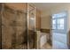 Bathroom with tiled walk-in shower and soaking tub at 901 Abernathy Ne Rd # 3020, Atlanta, GA 30328