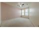 Bright bedroom with large windows offering natural light, featuring plush carpeting and a ceiling fan at 901 Abernathy Ne Rd # 3020, Atlanta, GA 30328