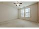 A well-lit bedroom with neutral carpet and a ceiling fan at 901 Abernathy Ne Rd # 3020, Atlanta, GA 30328