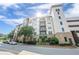 A striking exterior view of the Serrano condominium building, showcasing its architectural charm and inviting entrance at 901 Abernathy Ne Rd # 3020, Atlanta, GA 30328