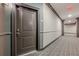 View of hallway with patterned carpet, apartment number on the door, and neutral colors at 901 Abernathy Ne Rd # 3020, Atlanta, GA 30328