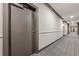 Long view down the hallway with patterned carpet and neutral colors on the walls at 901 Abernathy Ne Rd # 3020, Atlanta, GA 30328