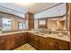 View of a kitchenette with dark cabinets and beautiful granite countertops at 901 Abernathy Ne Rd # 3020, Atlanta, GA 30328