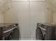 A practical laundry room equipped with Samsung washer and dryer, with ample space for cleaning and organization at 901 Abernathy Ne Rd # 3020, Atlanta, GA 30328