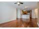 An open living space with hardwood floors that flows into the kitchen at 901 Abernathy Ne Rd # 3020, Atlanta, GA 30328