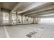 Interior view of a concrete parking garage with painted parking spot numbers at 901 Abernathy Ne Rd # 3020, Atlanta, GA 30328