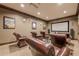 View of a comfortable theater room with a large screen and leather recliners at 901 Abernathy Ne Rd # 3020, Atlanta, GA 30328