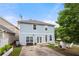 Charming two-story home featuring a well-maintained backyard with a small patio and cozy seating area at 240 Daisy Cir, Mcdonough, GA 30252