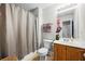 Cozy bathroom featuring a shower with curtain, vanity, and neutral color scheme, perfect for relaxation at 240 Daisy Cir, Mcdonough, GA 30252
