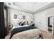 Bright bedroom with a tray ceiling, large window and minimalistic decor with a streamlined layout, perfect for relaxation at 240 Daisy Cir, Mcdonough, GA 30252