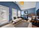 Cozy bedroom with a comfortable couch and access to a private balcony with natural light at 240 Daisy Cir, Mcdonough, GA 30252