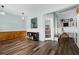 Spacious bonus room with stylish cabinets, plank floors, and wainscoting, offering an inviting and functional area at 240 Daisy Cir, Mcdonough, GA 30252