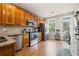 Well-equipped kitchen with stainless steel appliances, granite countertops, and ample cabinet space at 240 Daisy Cir, Mcdonough, GA 30252